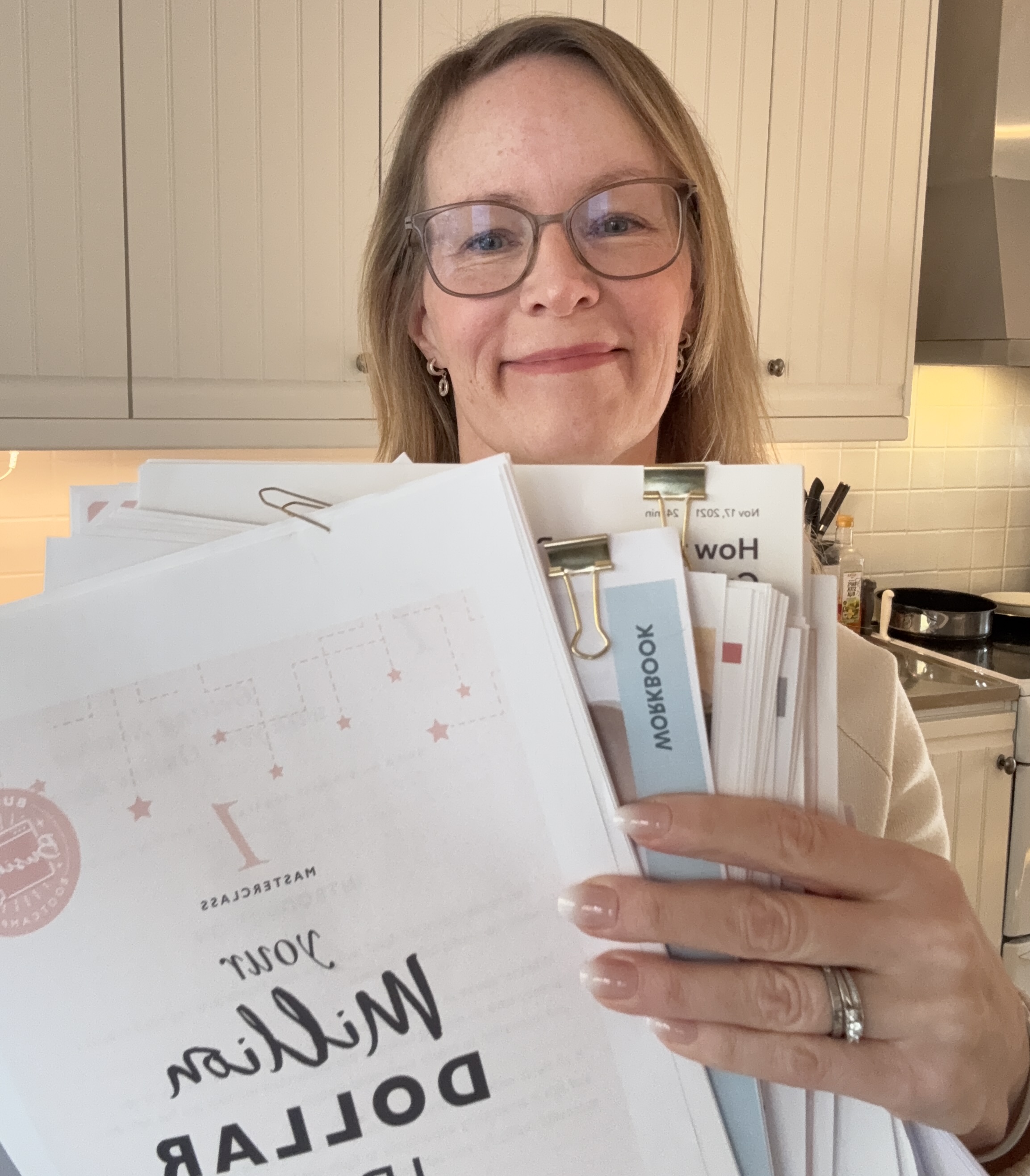 Jenny holding ideas and workbooks